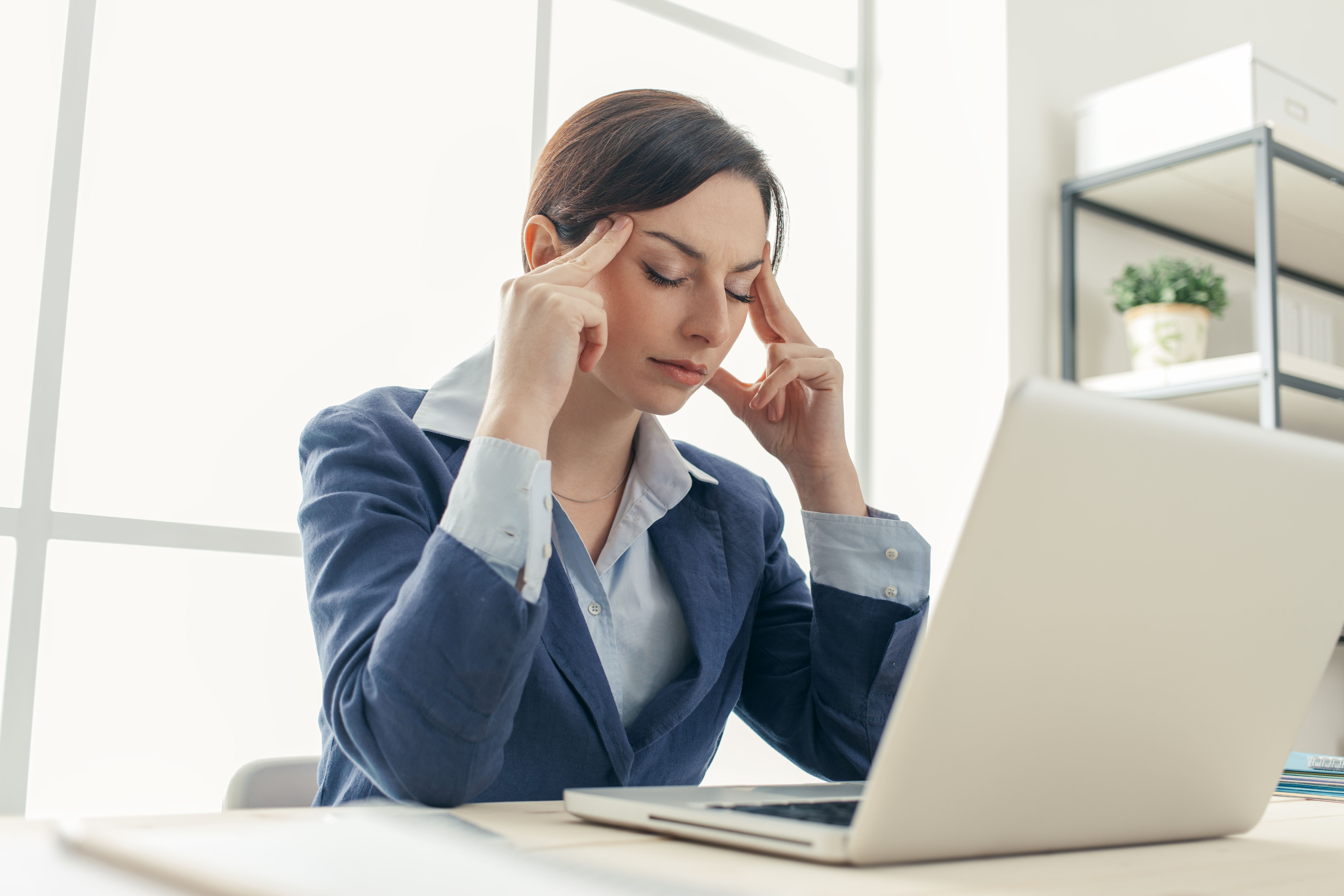 Exhausted businesswoman at work | Star Wellness